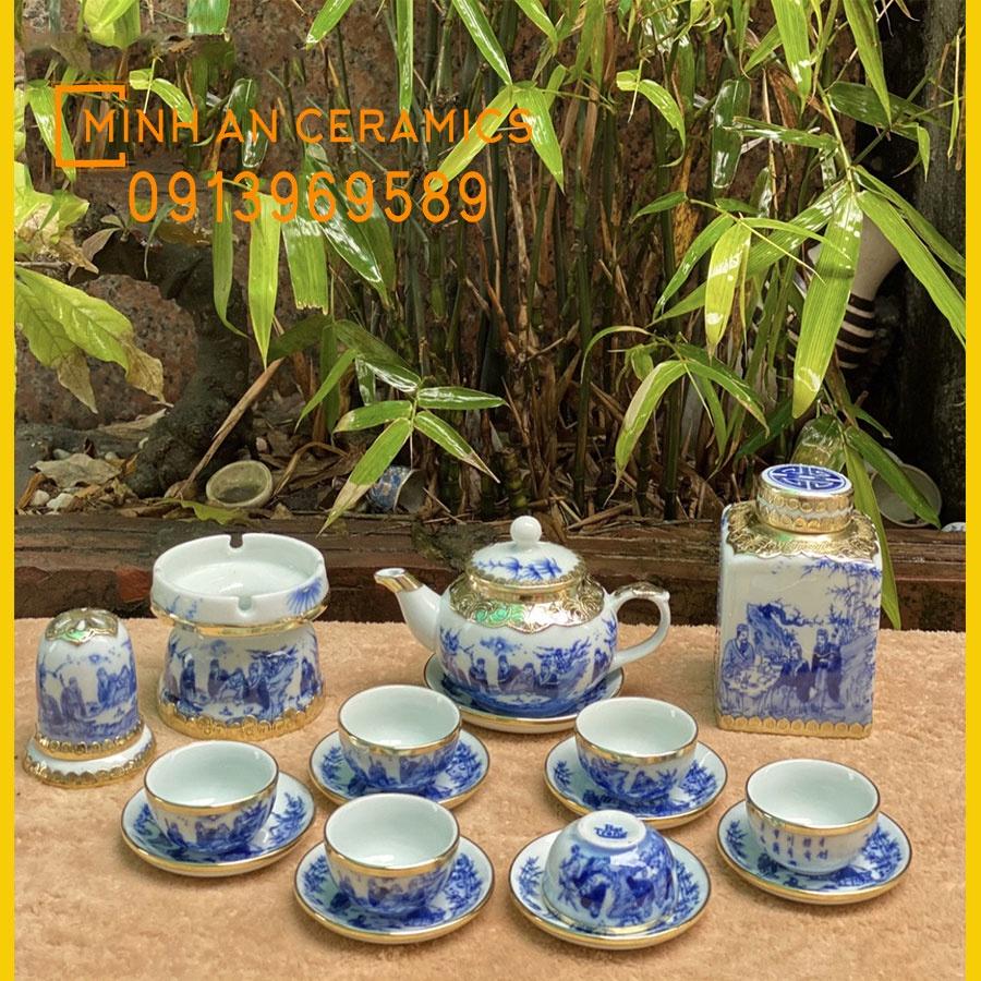 Bộ ấm trà gốm sứ Bát tràng men lam vẽ trúc lâm thất hiền bọc đồng vàng gốm Minh An Bát Tràng dáng ấm quả hồng