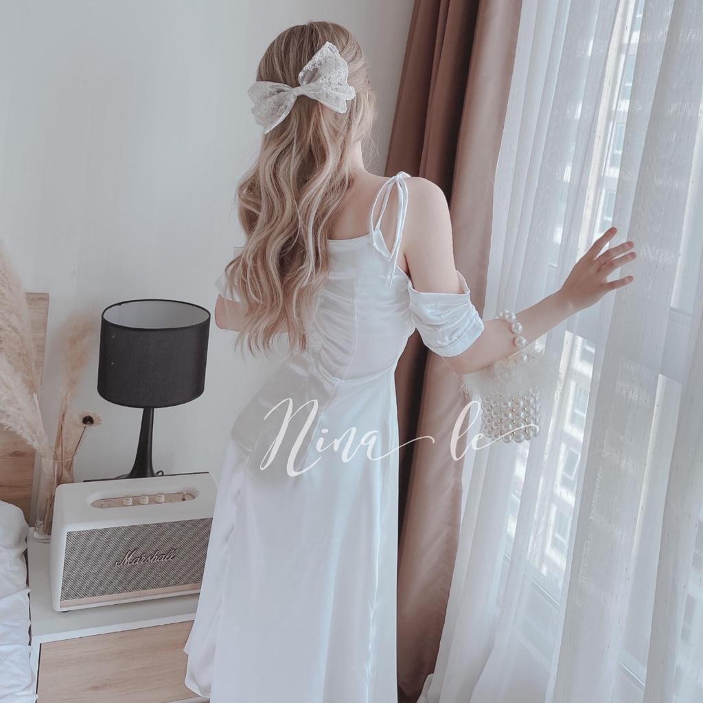 Đầm váy dự tiệc hai dây trễ vai xếp ly ngực màu trắng tinh khôi giúp nàng nổi bật.