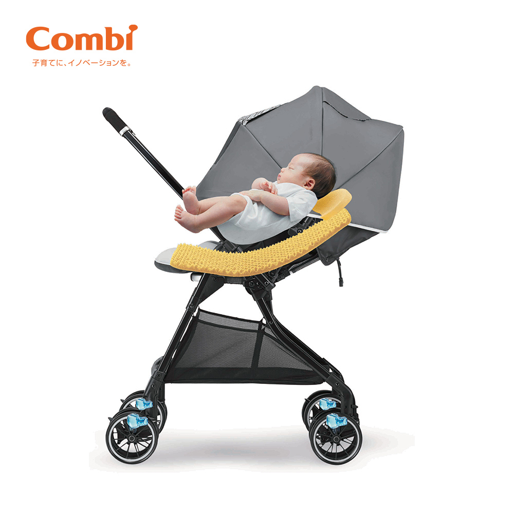 Xe đẩy Combi Sugocal Compact 4 bánh quay tự động màu đỏ/màu ghi