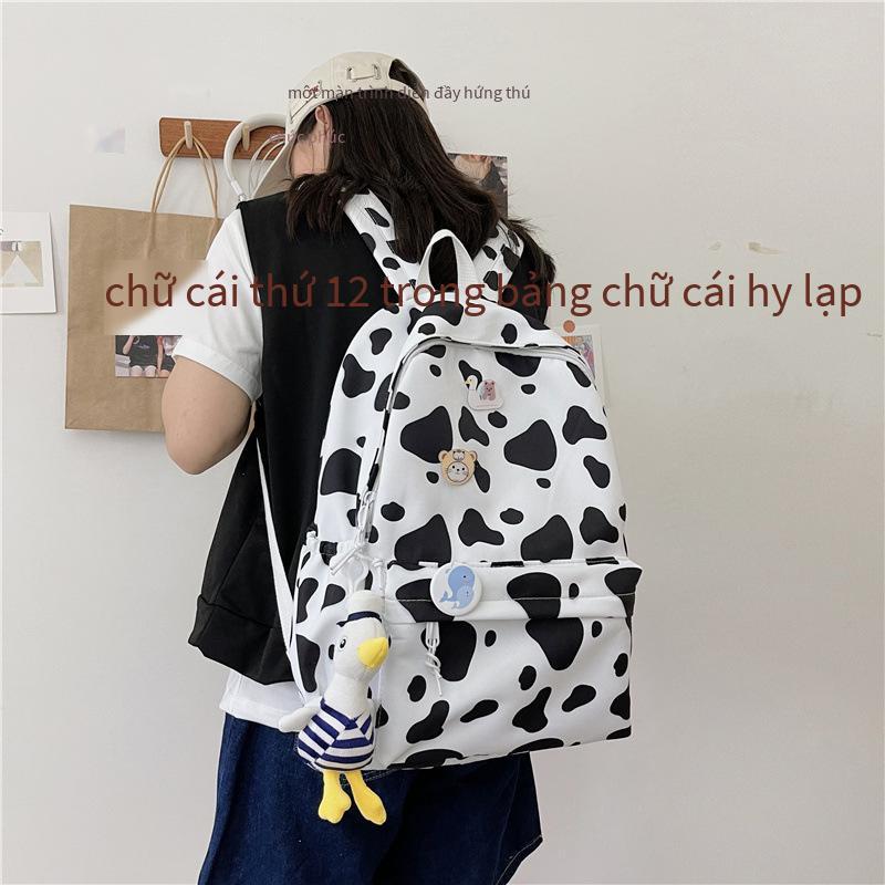 Ba lô học sinh nữ phong cách mới nhất phong cách Hàn Quốc thời trang học sinh trung học ba lô nylon in ba lô hợp thời trang sức chứa lớn ba lô học sinh trung học cơ sở