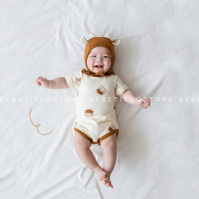 Bộ Áo Liền Quần Họa Tiết Trâu Cotton Mát Cho Bé Trai Bé Gái Kèm Mũ Bebé Tí Tẹo