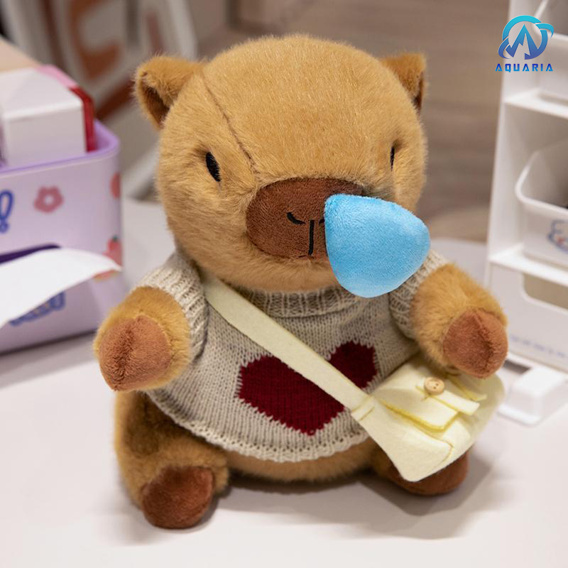 Gấu Bông Thú Nhồi Bông Capybara Mặc Áo Len Đeo Túi Có Thể Kéo Mũi Siêu Đáng Yêu 25cm (Mẫu Áo Len Ngẫu Nhiên)