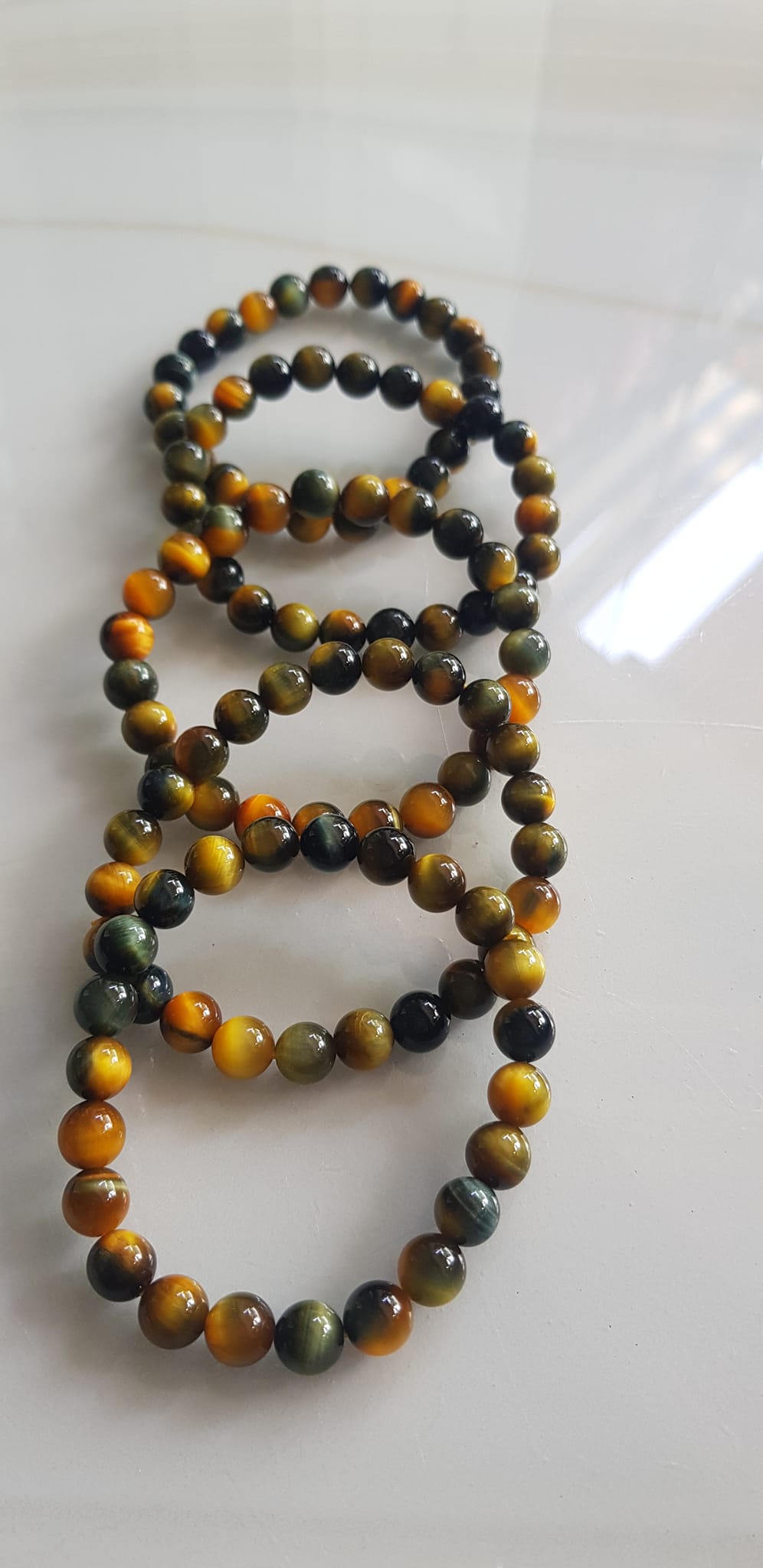 Vòng tay phong thủy may mắn Nữ đá mắt hổ tự nhiên vàng xanh đều mới bóng mượt đẹp Size hạt 8mm Nữ đeo Công dụng vòng đá mắt hổ đá thiên nhiên tốt cho sức khỏe, đem đến may mắn,xoa dịu tâm trí công việc hanh thông ạ