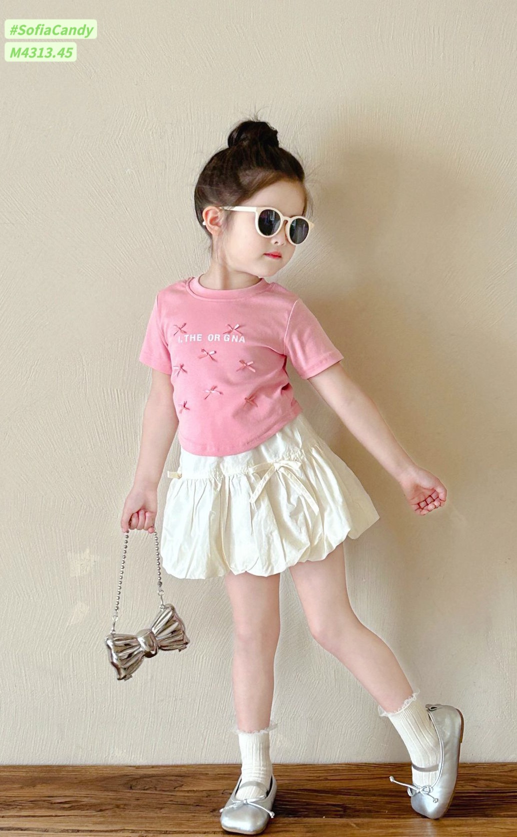 [Từ 1 đến 12 tuổi] Sét áo cotton hồng đính nơ mix chân váy ngắn tơ nhăn mềm (có quần) bé gái đến 45kg