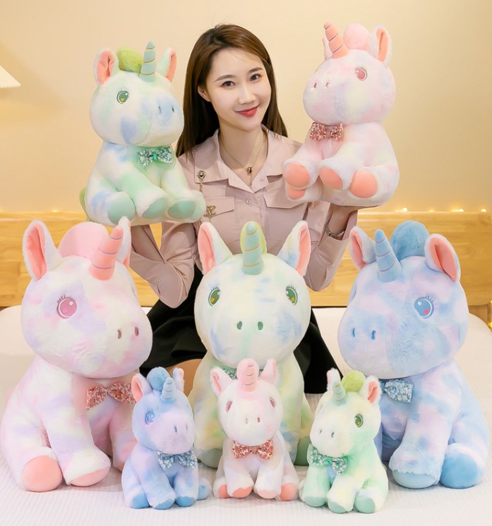 Gấu bông Màu loang Unicorn mắt trái tim đính nơ voan hoa 28cm siêu xinh