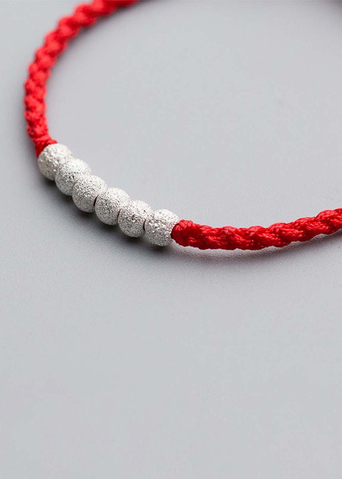 Combo 2 vòng thắt dây đỏ charm bạc - Ngọc Quý Gemstones