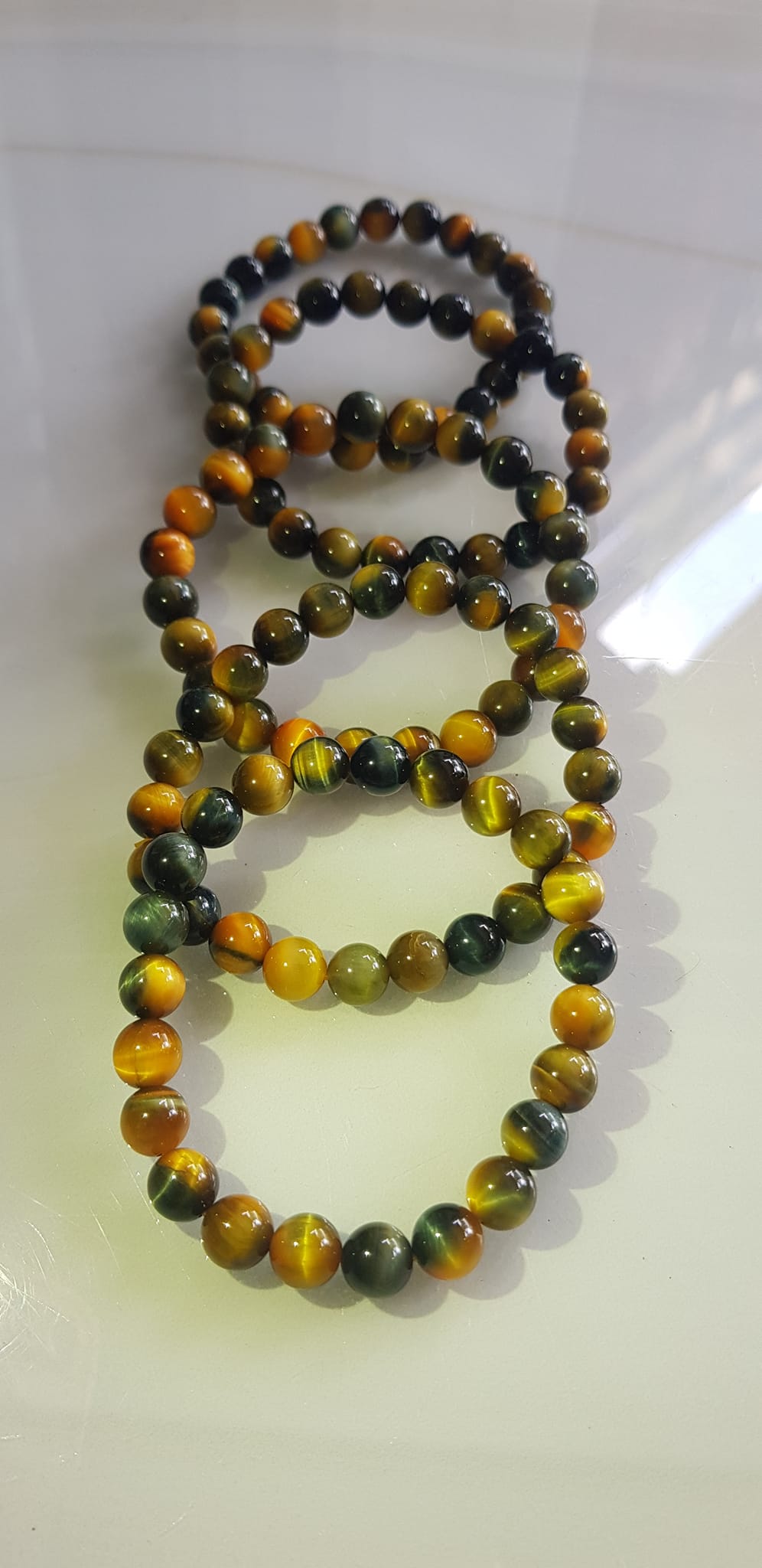 Vòng tay phong thủy may mắn Nữ đá mắt hổ tự nhiên vàng xanh đều mới bóng mượt đẹp Size hạt 8mm Nữ đeo Công dụng vòng đá mắt hổ đá thiên nhiên tốt cho sức khỏe, đem đến may mắn,xoa dịu tâm trí công việc hanh thông ạ