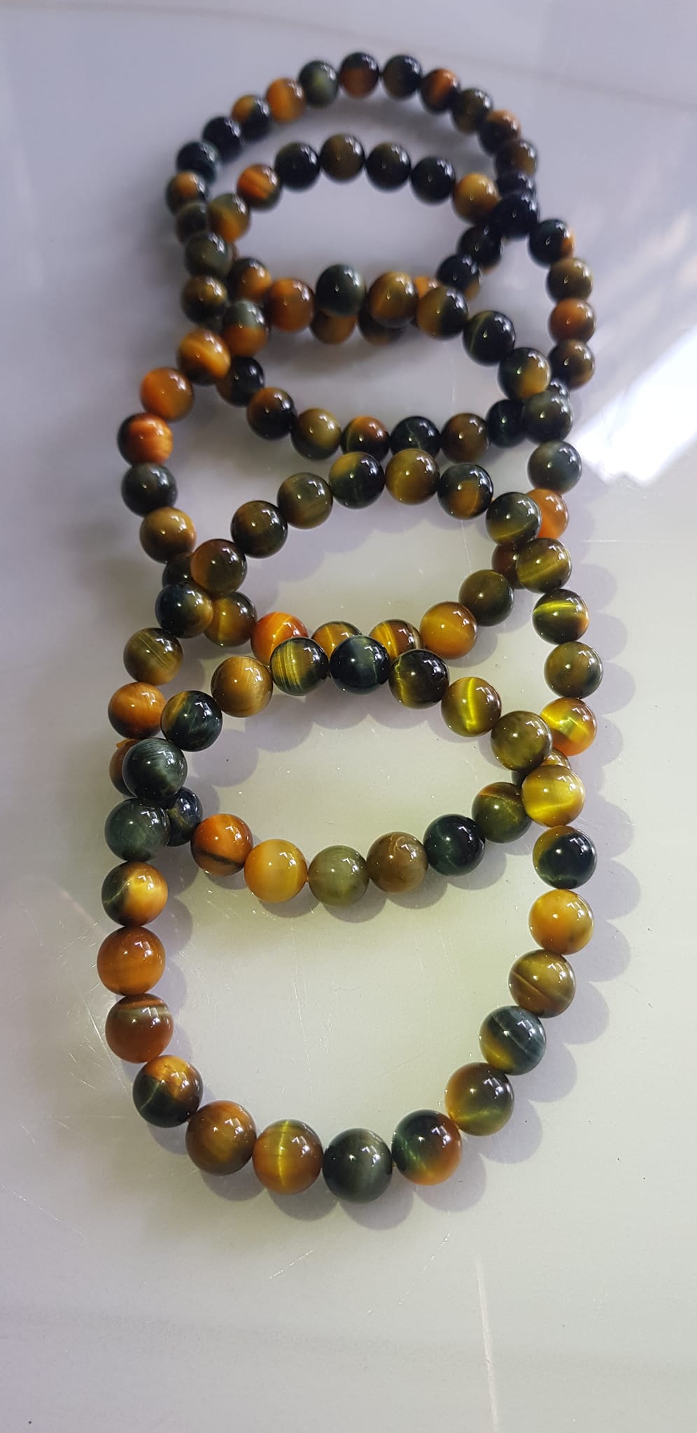 Vòng tay phong thủy may mắn Nữ đá mắt hổ tự nhiên vàng xanh đều mới bóng mượt đẹp Size hạt 8mm Nữ đeo Công dụng vòng đá mắt hổ đá thiên nhiên tốt cho sức khỏe, đem đến may mắn,xoa dịu tâm trí công việc hanh thông ạ