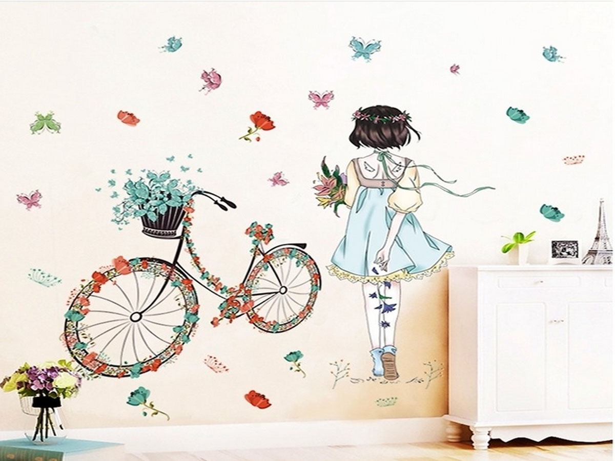 Decal dán tường cô gái quay lưng xe đạp