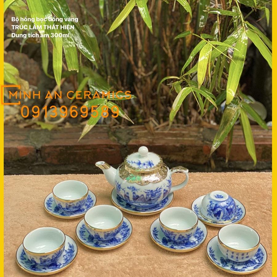 Bộ ấm trà gốm sứ Bát tràng men lam vẽ trúc lâm thất hiền bọc đồng vàng gốm Minh An Bát Tràng dáng ấm quả hồng