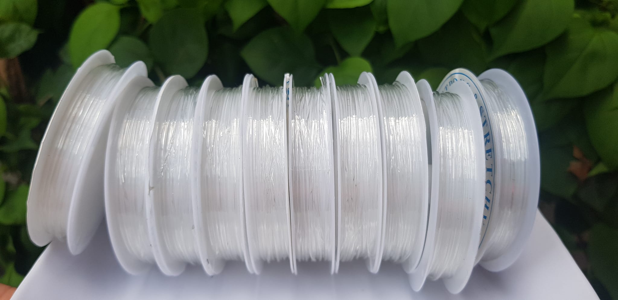 Khoanh tròn cuộn Thun Dẻo Màu trắng nhỏ chuyên xỏ tất cả vòng đeo tay Thun dẻo trắng xỏ vòng tay nam nữ ạ