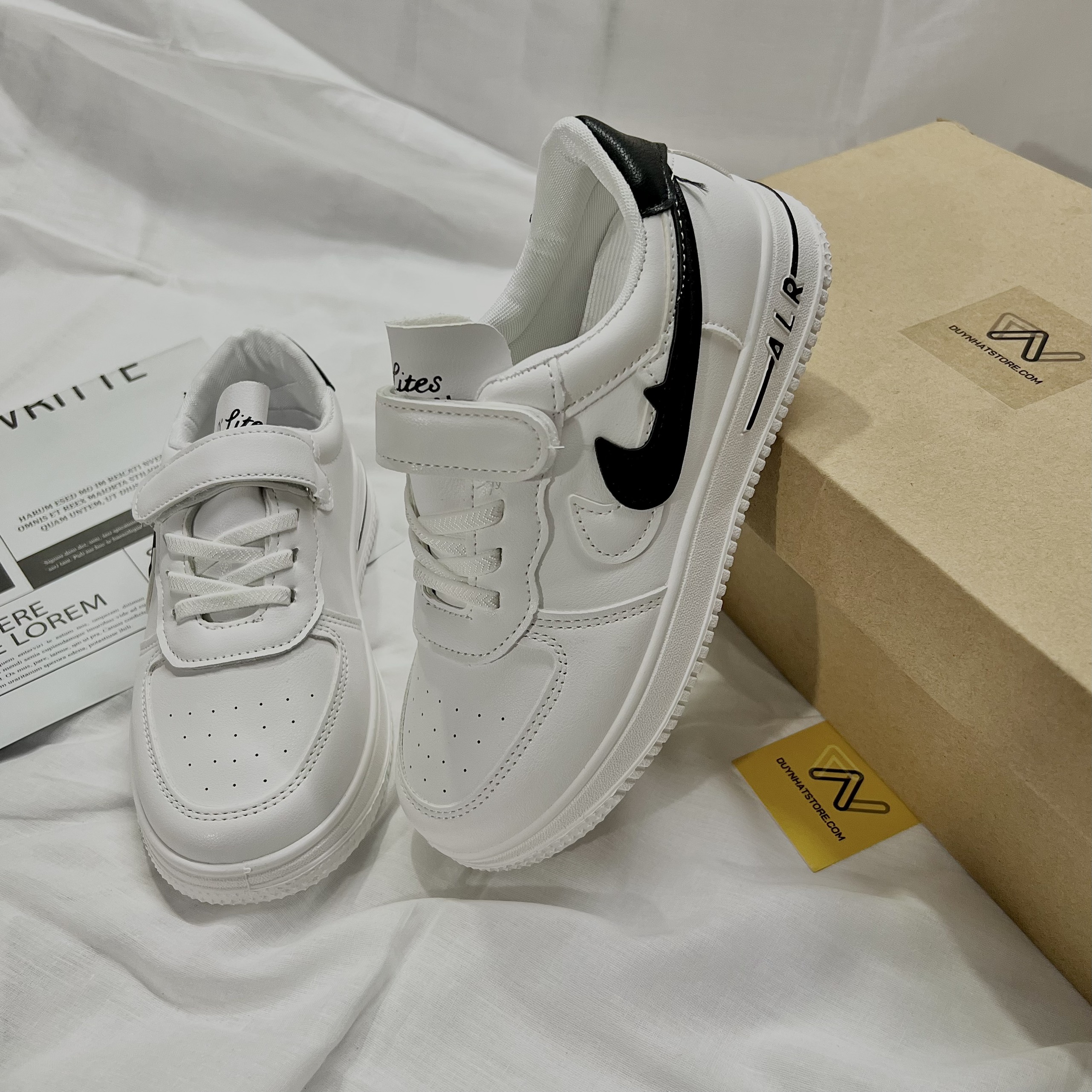 Giày Thể Thao Em Bé Trai Gái Móc Màu Trắng Đen Nai Duy Nhật Store Sang Uzzang Đẹp Êm Sneaker Bata Trend Size Lớn Dán Dây