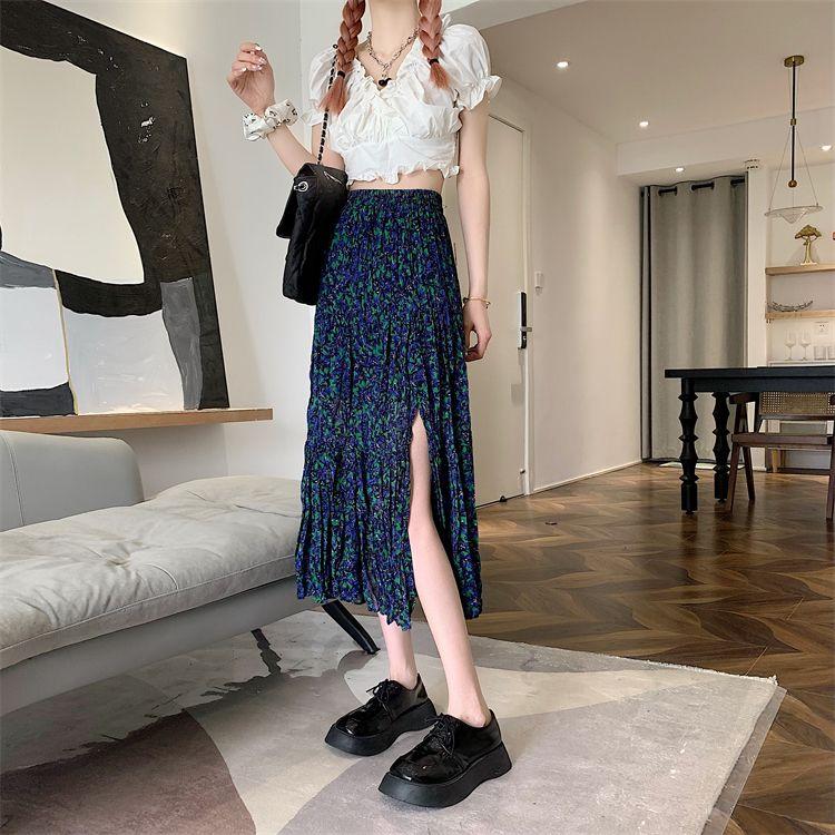 DONGSHOP Cao cấp hoa xẻ tà nửa người váy mùa xuân và mùa hè 2023 Vintage thả cảm thấy gầy váy xếp li một chữ dài váy