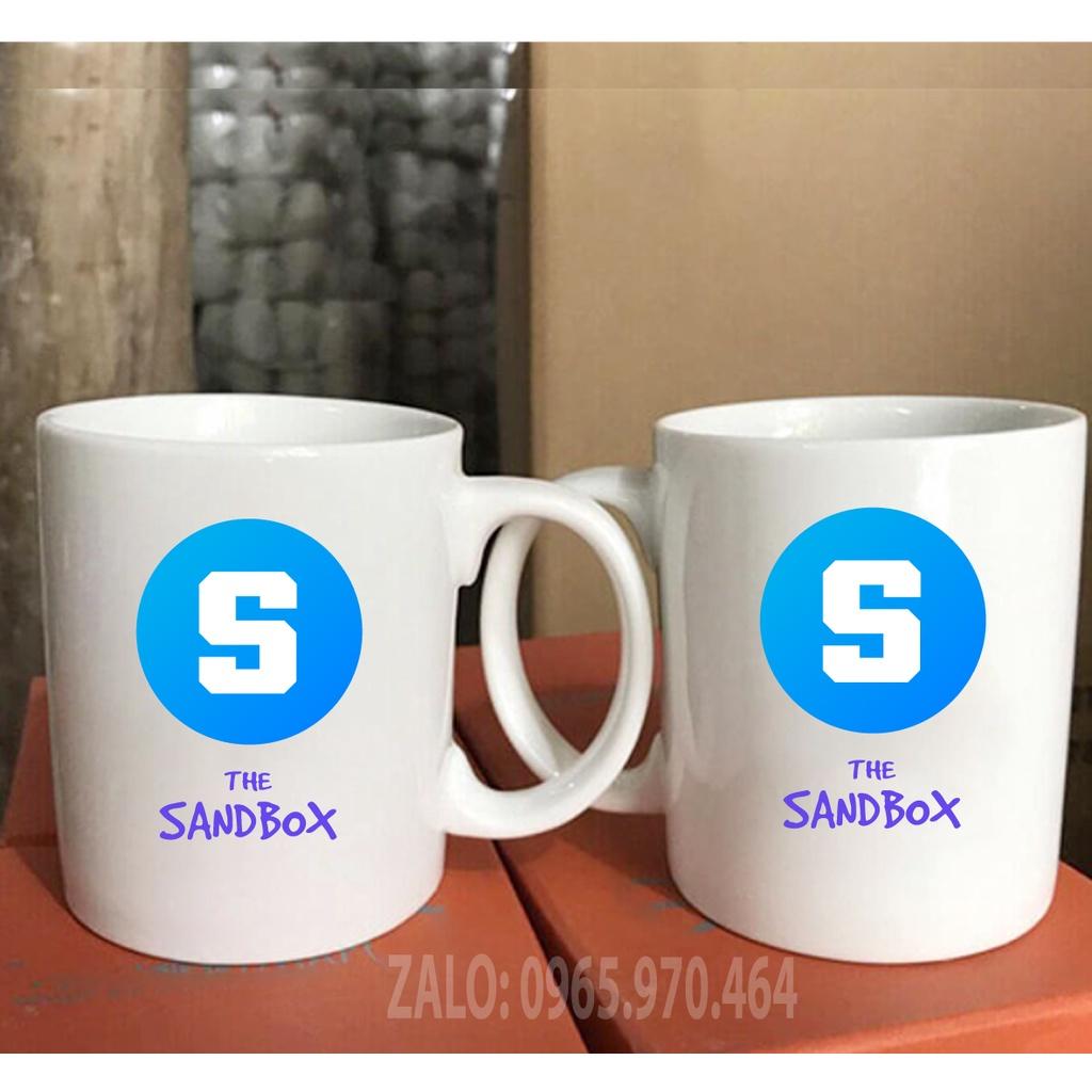 Ly Sứ Có Quai Họa Tiết Đồng Coin THE SANDBOX - In hình lên ly sứ, cốc theo yêu cầu của bạn - HÌNH LỚP, CÔNG TY