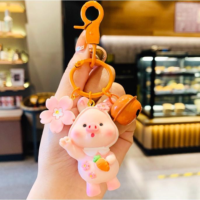 Móc khóa heo con biêu cảm có chuông kêu dễ thương xỉu PVC loại tốt