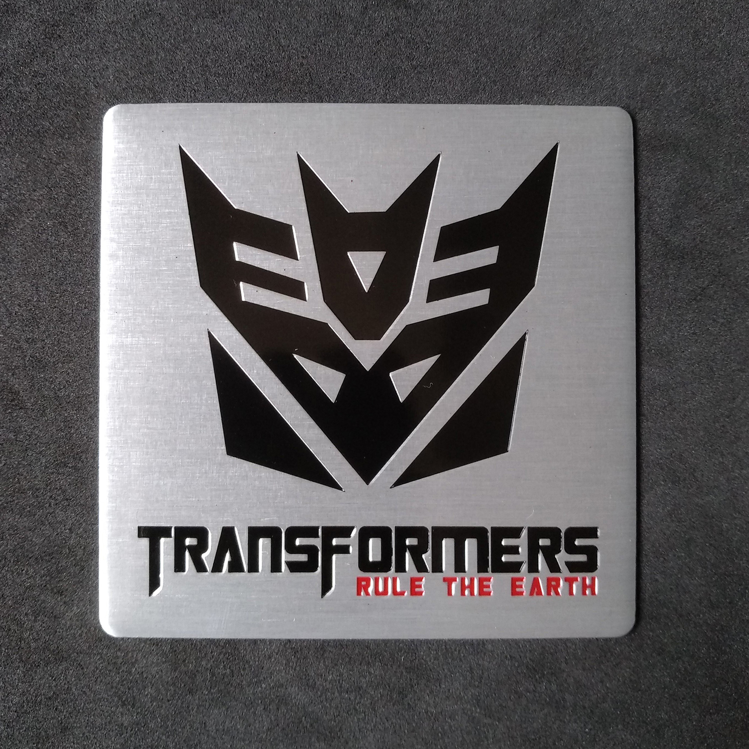 Miếng dán kim loại hình TRANSFORMERS DECEPTICON rule the earth 8cm