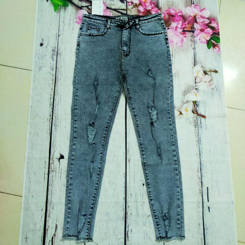 Quần jeans lưng cao co giãn rách tua lai