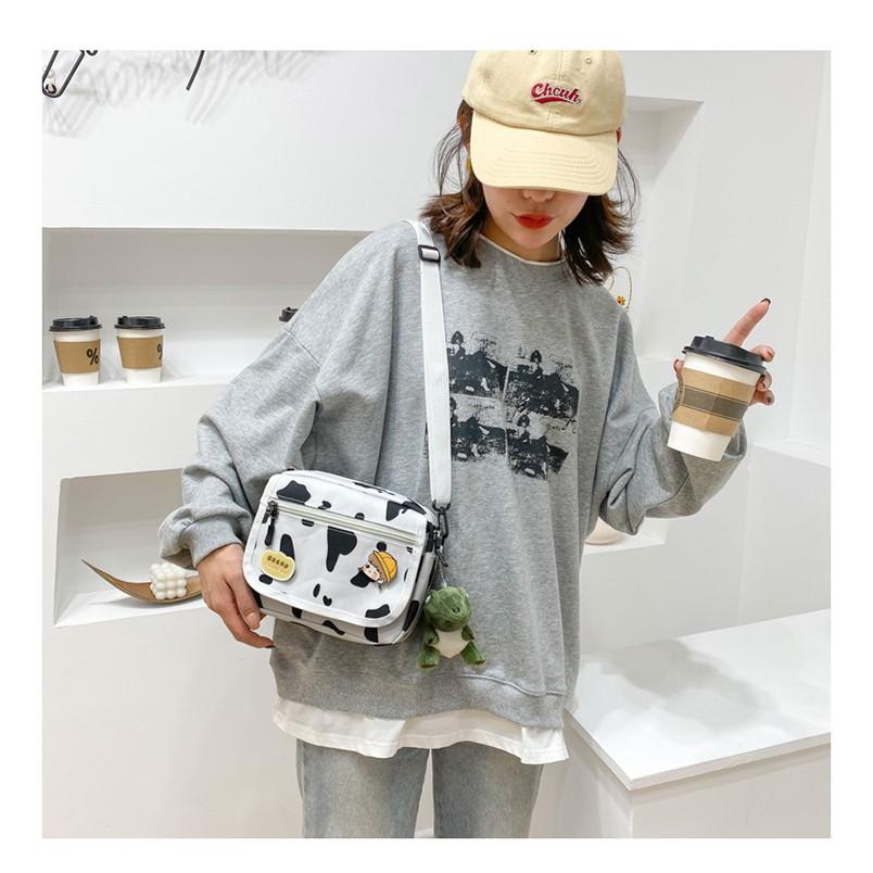 TÚI ĐEO CHÉO NAM NỮ HỌA TIẾT BÒ SỮA