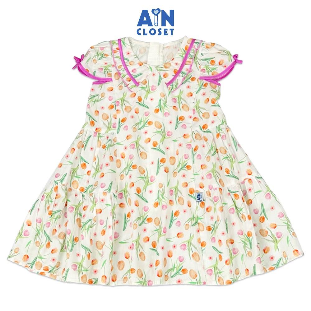 Đầm bé gái họa tiết Tulip Cam Viền Tím cotton - AICDBGDKS94K - AIN Closet