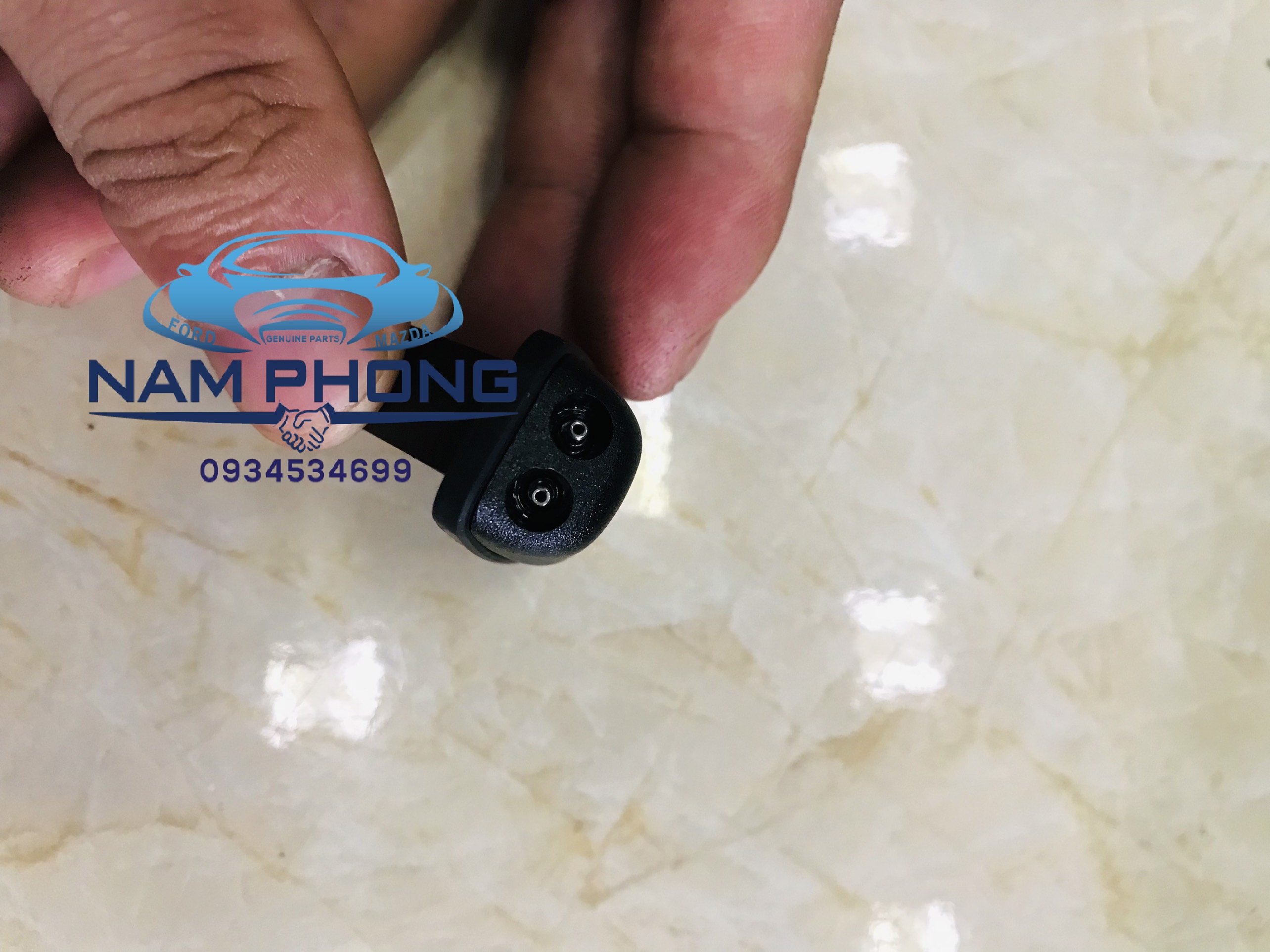 Núm phun nước rửa kính dành cho focus 07 - mã 4M5117666AD