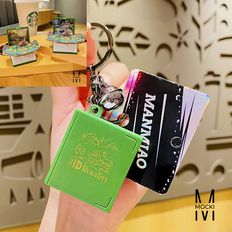 Móc khóa quyển sách bật ra là mô hình làng quê