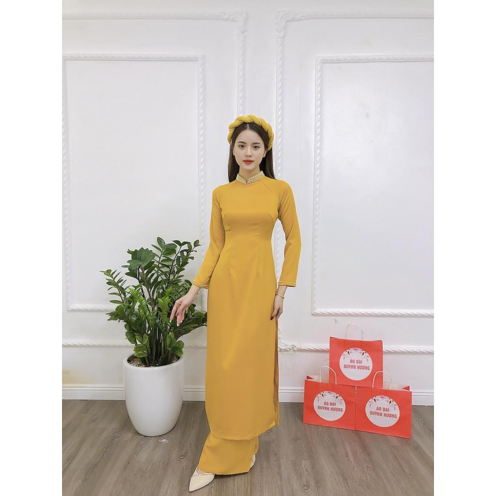 Áo dài lụa tây thi màu vàng cổ truyền thống đính hạt by Quỳnh Hương