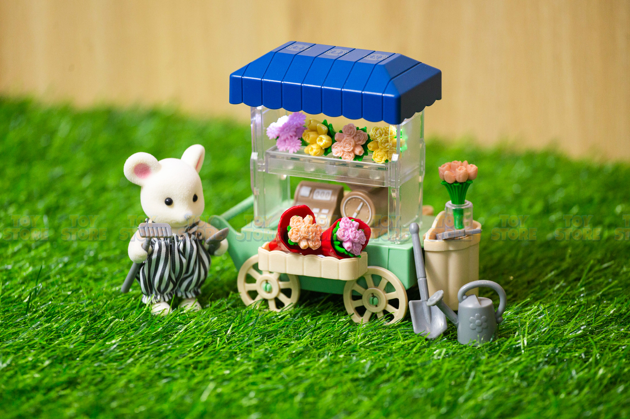 Mô hình búp bê xe đẩy bán hoa có đèn và nhạc