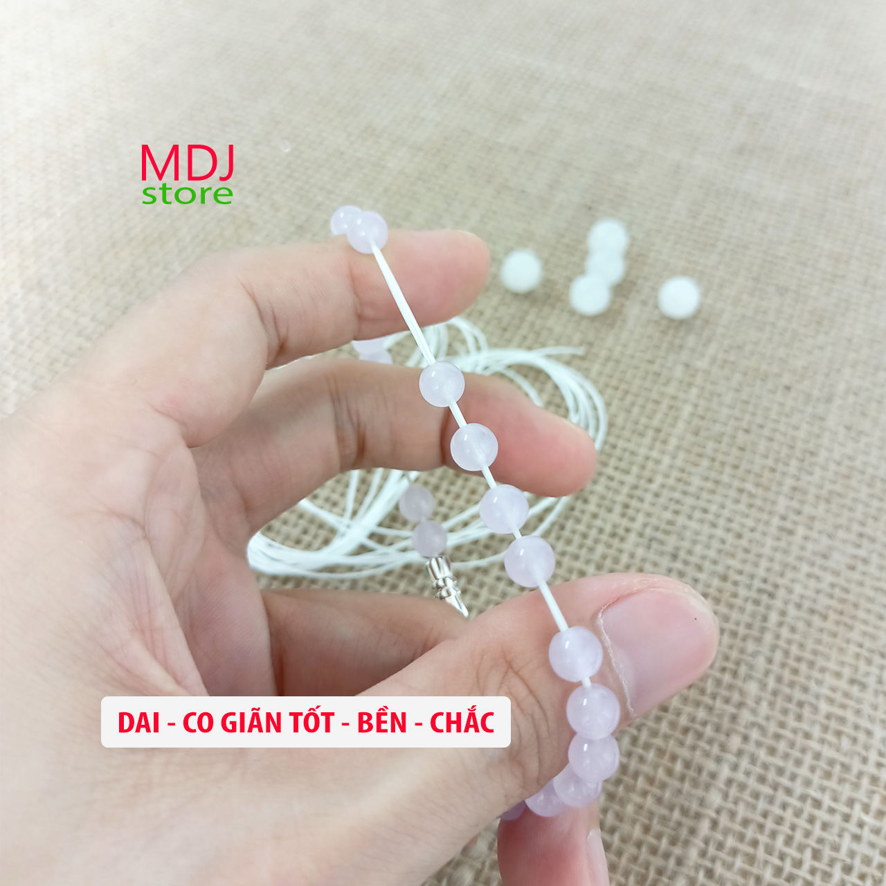 Dây chun xâu vòng tay đá màu trắng 1 cuộn 35 mét/ lẻ 3 mét kèm 1 kim gập xỏ dây - MDJ