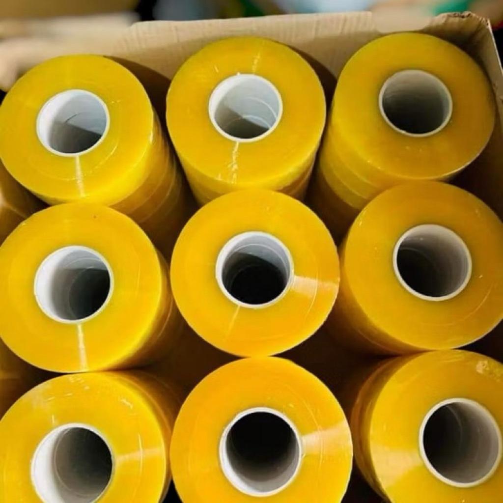Băng dính và băng keo 1kg/1cuộn Độ Bám Dính Siêu Tốt Chống Thấm Nước Dễ Kéo Dài Và Bền Màu Sắc Trong Vàng Đục Chất Lượng Cao bang dinh