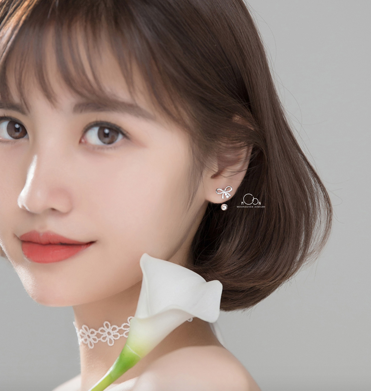 Khuyên tai nơ chốt bi