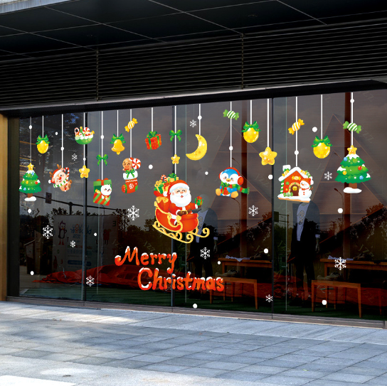 Decal dán tường - ông già ngồi trên xe đi phát quà cho các em nhỏ