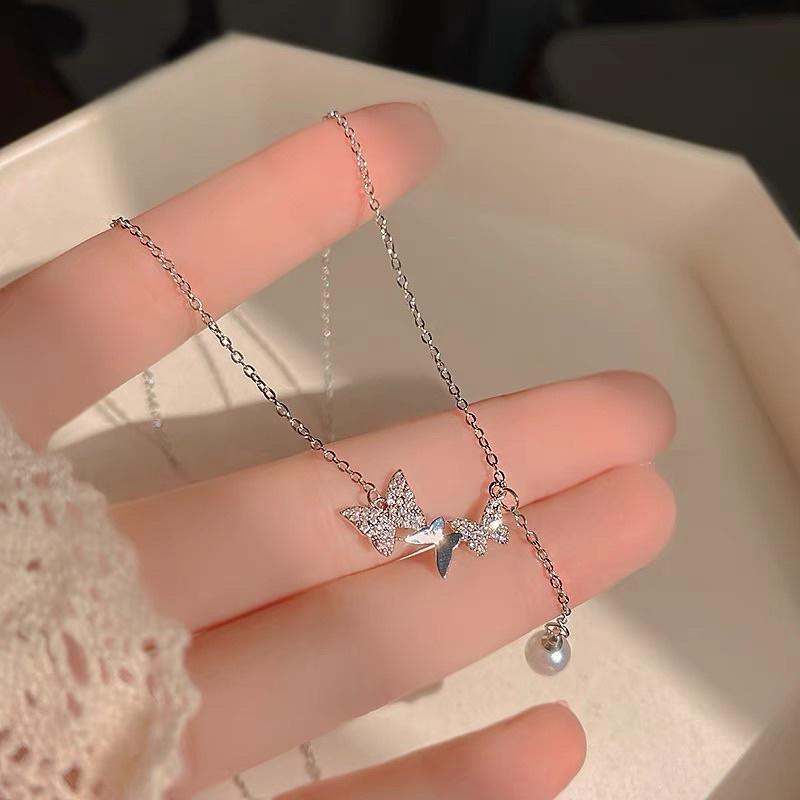 Dây chuyền vòng cổ nữ titan không đen chuỗi bướm thả hạt trai đẹp Ring House