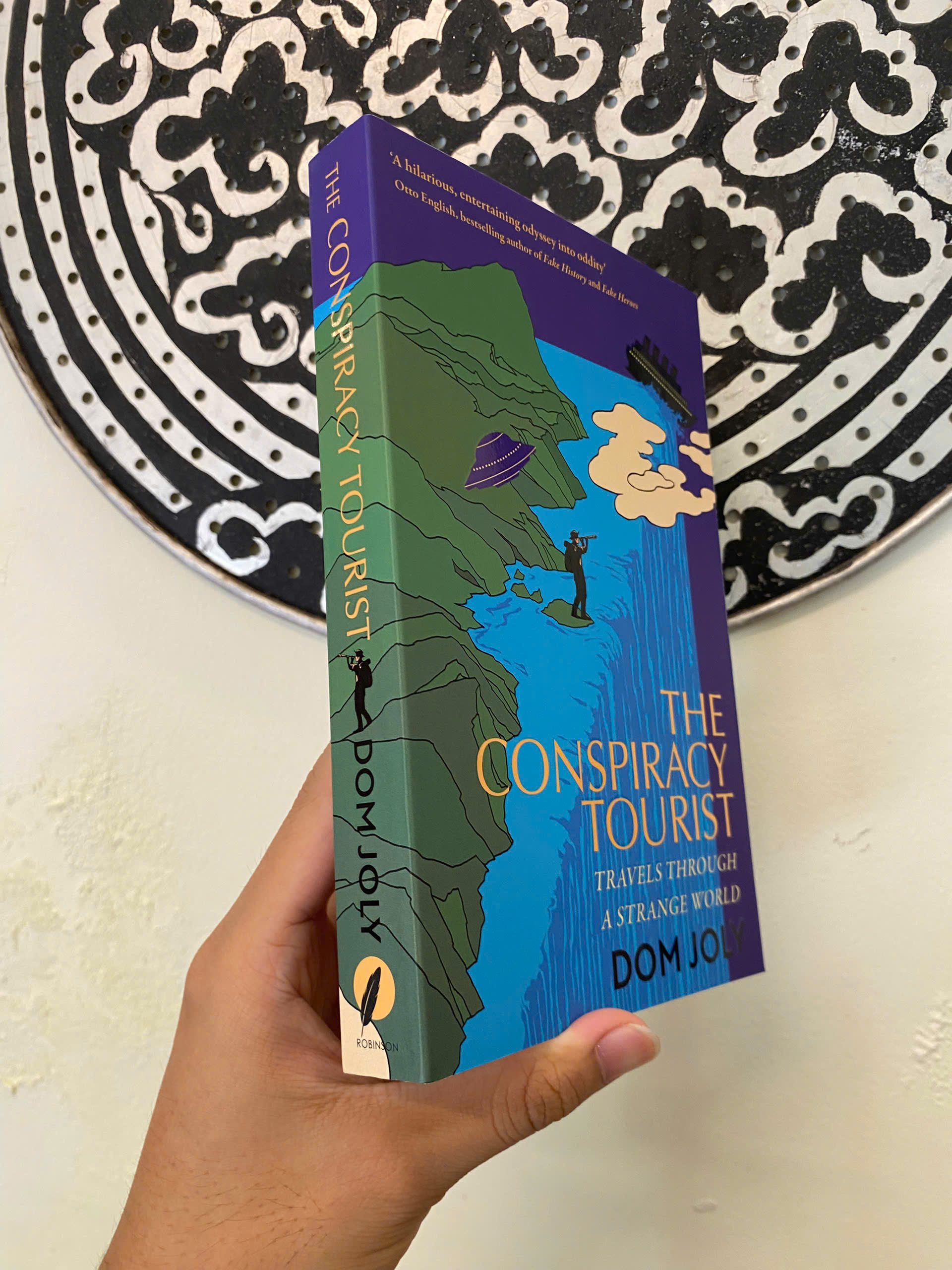 Sách - The Conspiracy Tourist: Travels Through a Strange World by Dom Joly | Travel Nonfiction