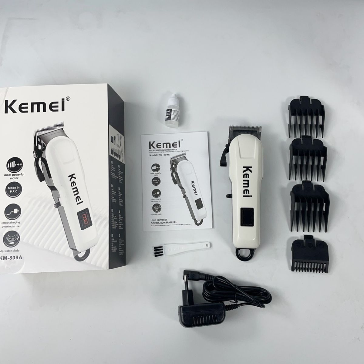 Tông đơ cắt tóc KEMEI KM-809A có màn hình hiển thị pin, nhiều cữ linh hoạt, lưỡi sắc, pin bền
