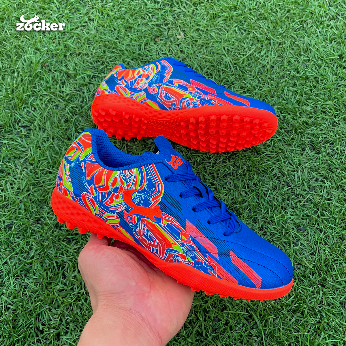 Giày đá bóng trẻ em Zocker Kiên Cường Royal Blue/Orange - Êm - Bền - Bảo Vệ Chân Tránh Chấn Thương Cho Bé Nhờ Công Nghệ Ma Sát Kép - Tặng Túi Chính Hãng