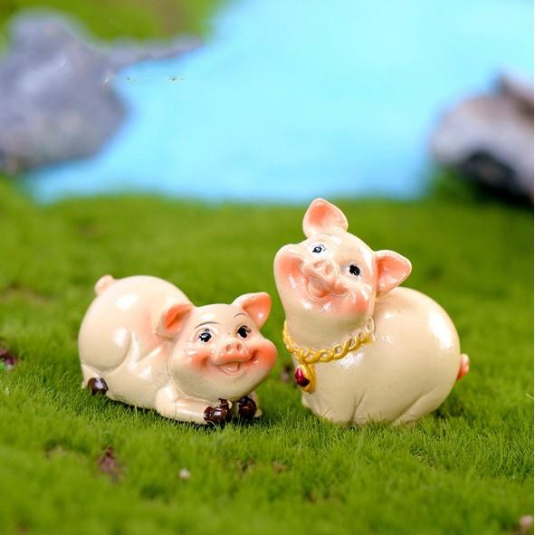 Mô hình lợn hồng béo múp sang chảnh với đầy vàng bạc bên người cầu năm mới thịnh vượng