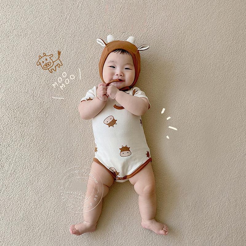 Bộ Áo Liền Quần Họa Tiết Trâu Cotton Mát Cho Bé Trai Bé Gái Kèm Mũ Bebé Tí Tẹo