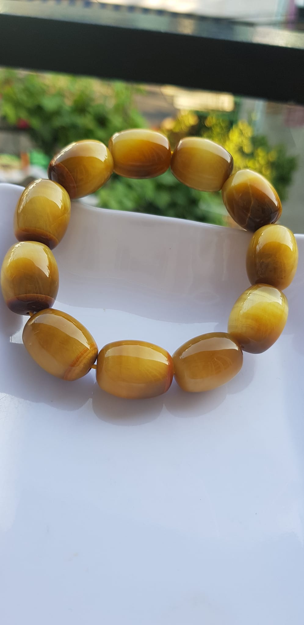 Vòng Tay Phong Thủy Nam Mệnh Thổ Kim Thủy Mới Đẹp Hạt Lu Thống Mới Vàng Nâu bóng đẹp Chất liệu đá mắt hổ tự nhiên vàng nâu bóng đẹp ạ Size hạt 14mm x dài 19mm ạ