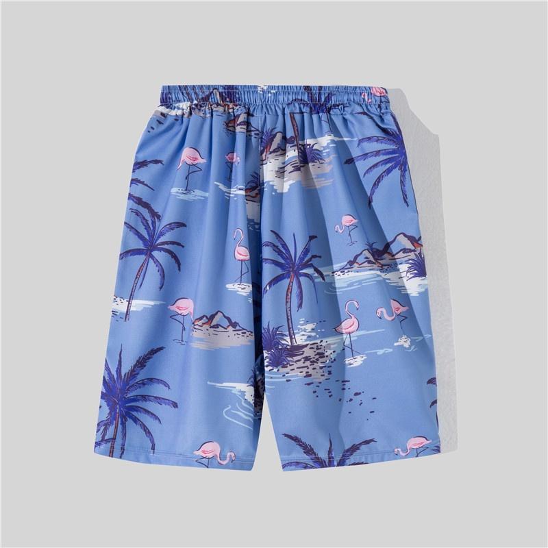 Bộ đồ đi biển gồm áo tay ngắn in hoa và quần dáng rộng phong cách Hawaii dành cho nam