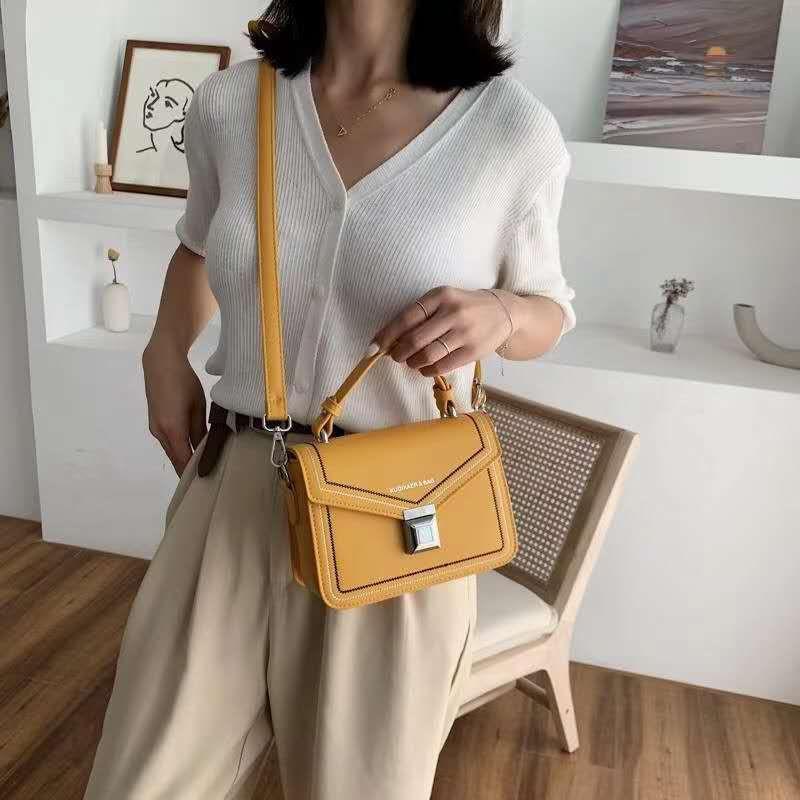 Túi đeo chéo nữ hàng Quảng châu trần chỉ khóa bấm
