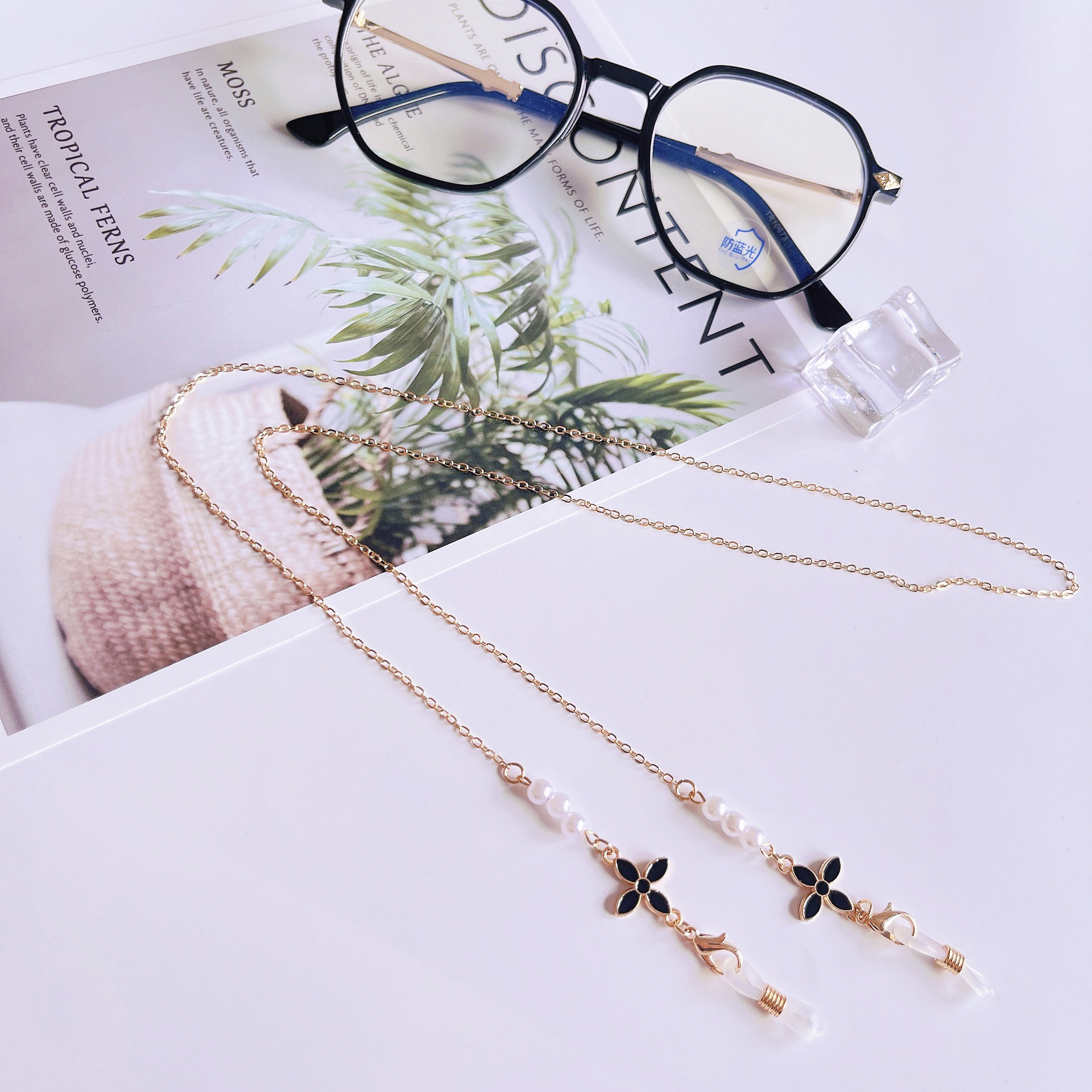 Dây chuyền mặt nạ cỏ bốn lá Dây đeo kính ngọc trai đơn giản Dây đeo mặt nạ đa năng Dây chống thất lạc tai nghe
