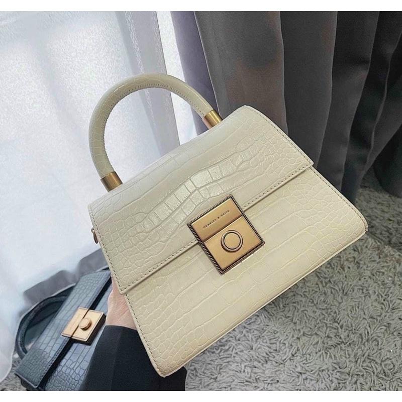 Túi da rắn quai xách khuy tròn size 22cm vỡ hộp