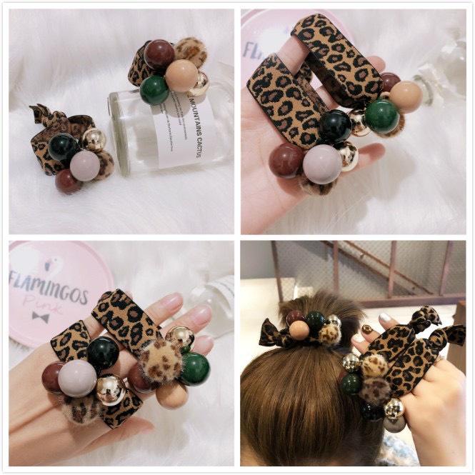 CỘT TÓC THUN DA BEO GẮN CHÂU PHONG CÁCH - NUNAM SHOP