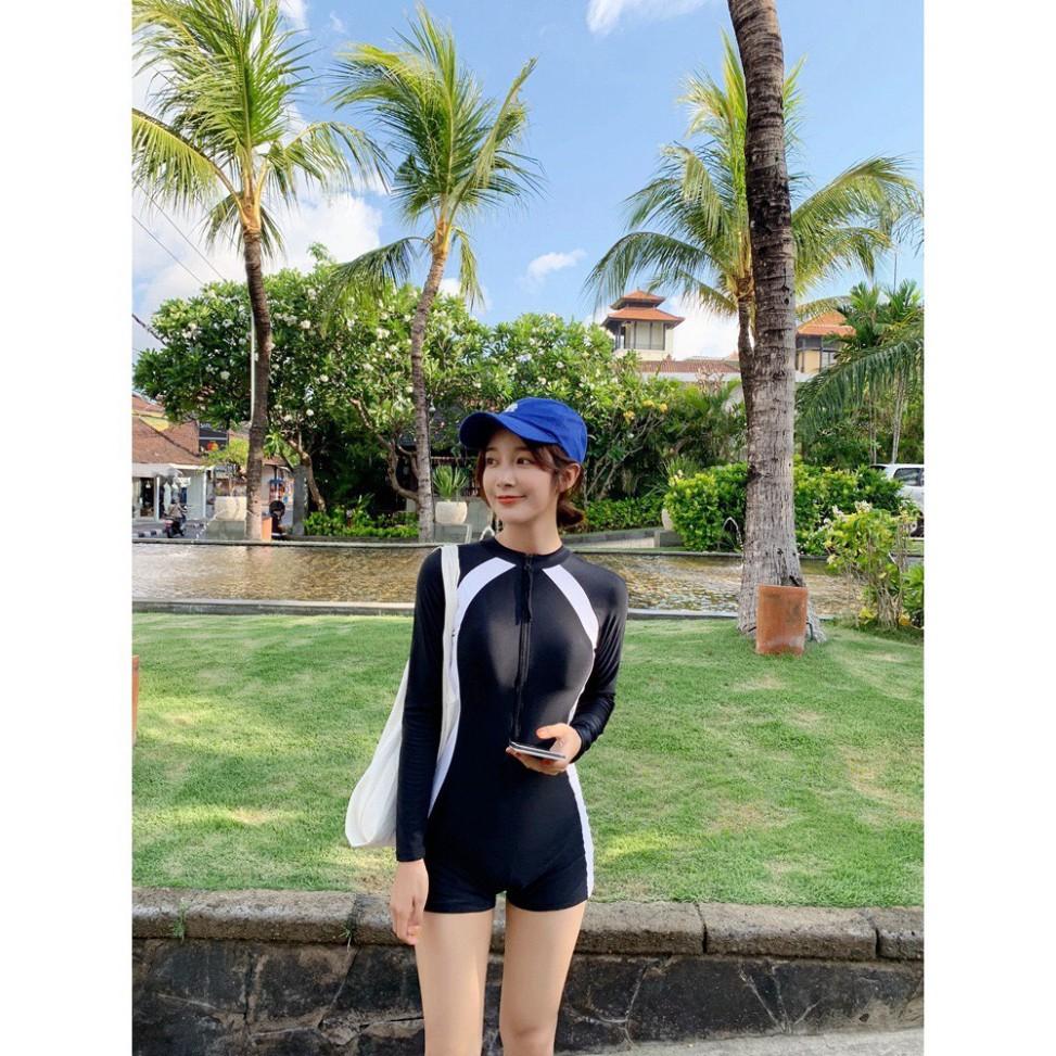 Bikini liền mảnh, bodysuit có tay khoá kéo màu đen chạy sọc trắng, quần form short kín đá