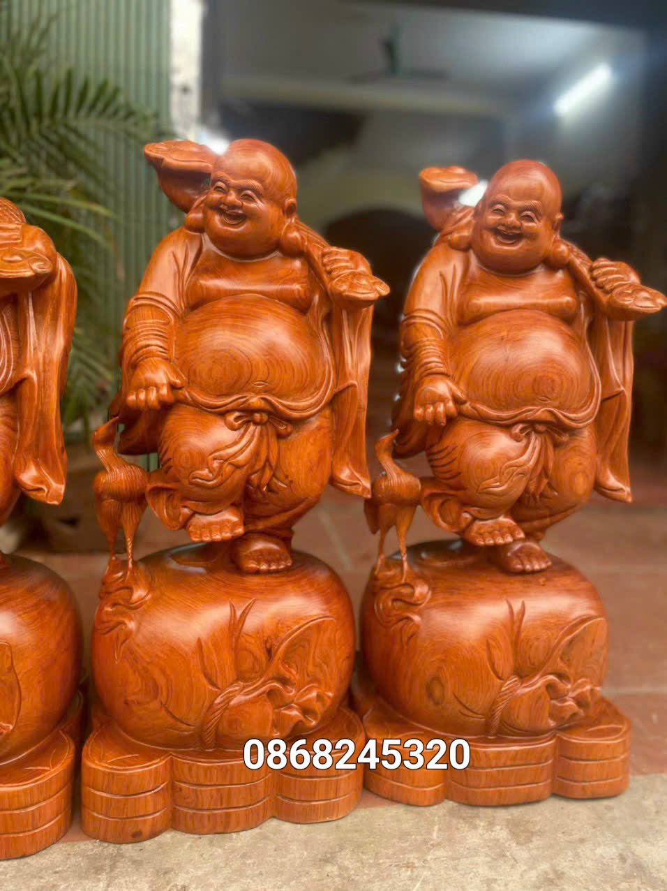 Tượng phật di lặc dắt cò phong thủy bằng gỗ hương đá kt cao 70×30×28cm