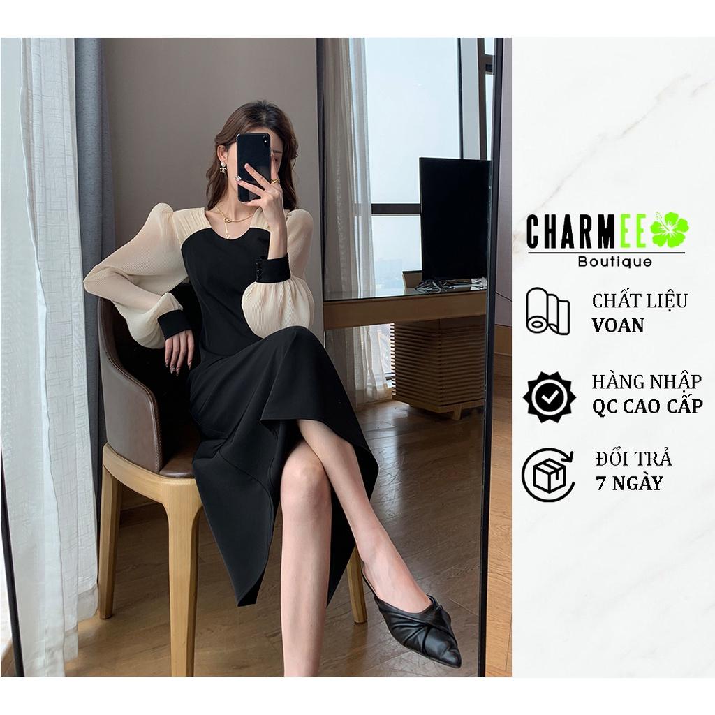 Đầm đen tay kem cổ tròn