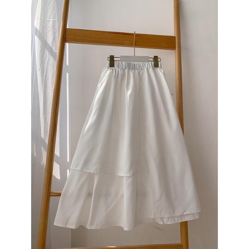 Chân váy trắng vạt thấp vạt cao