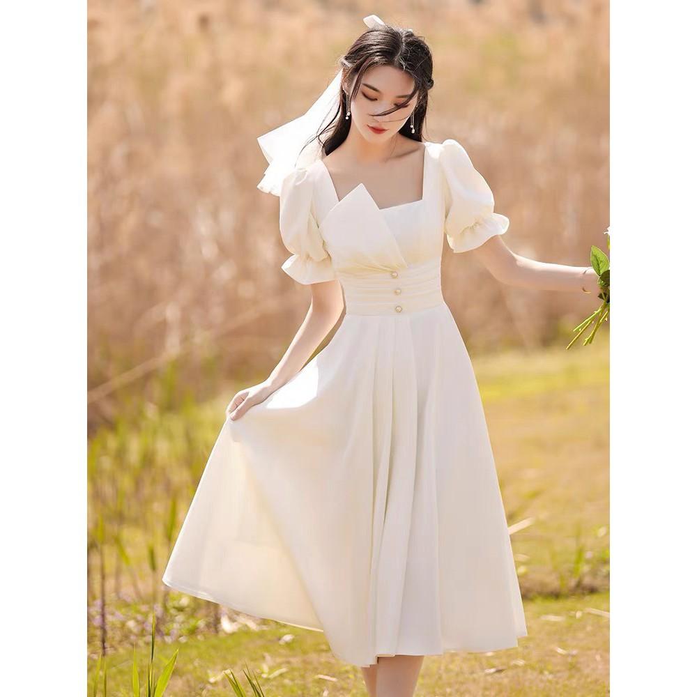 ĐẦM TRẮNG DỰ TIỆC VẢI MG 2 LỚP CỔ VUÔNG XẾP LY EO PHỐI NÚT CƯỜM TAY NGẮN BO CHUN DÁNG XÒE