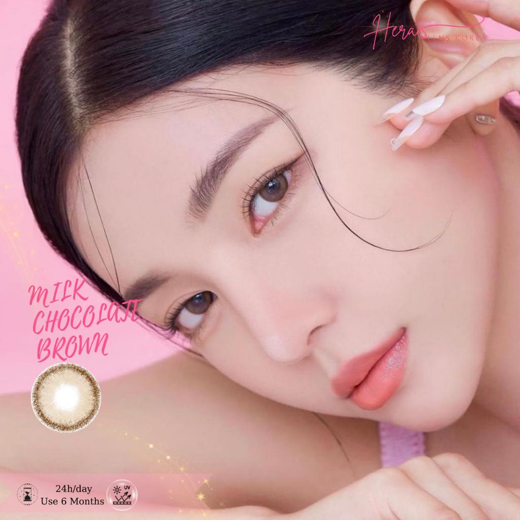 Kính Áp Tròng Hera Nâu Choco Sữa 0 - 6 Độ MILK CHOCOLATE BROWN Nhập Khẩu Hàn Quốc Lens Không Cận 6 Tháng (1 Cặp)