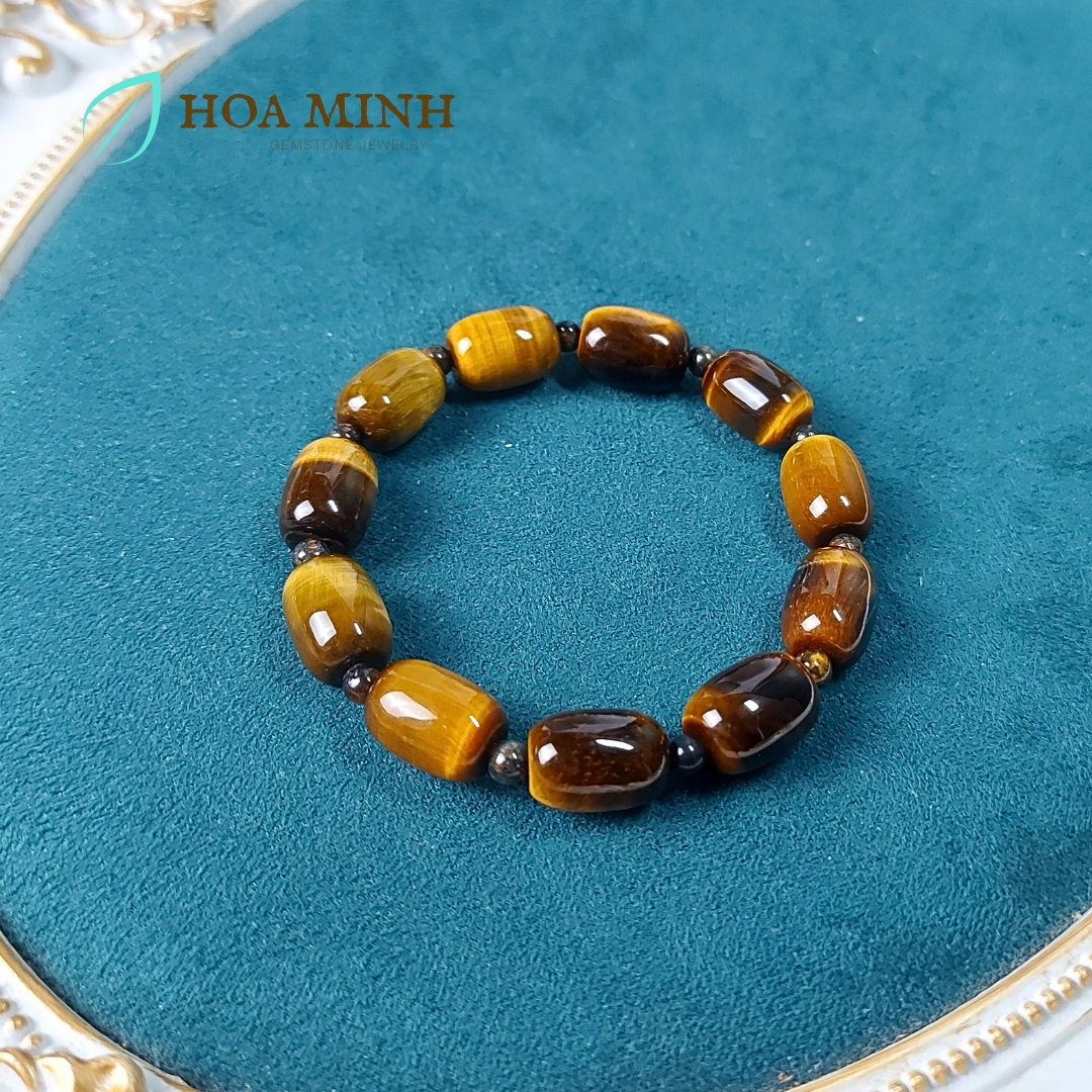 Vòng tay đá Mắt Hổ vàng nâu size 14x10 li chất 4A kiểu lu thống phối xen kẽ viên mắt hổ tròn